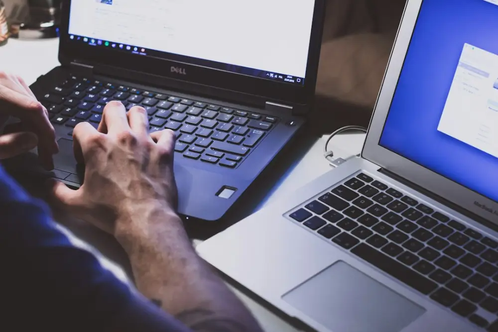 Person using black laptop computer, illustrating computer experience